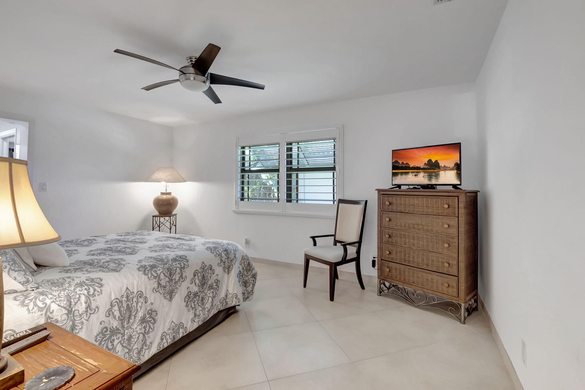 902 Foxpointe Circle Delray Beach, FL 33445 - Photo 31 of 43 a bedroom with a bed and a window