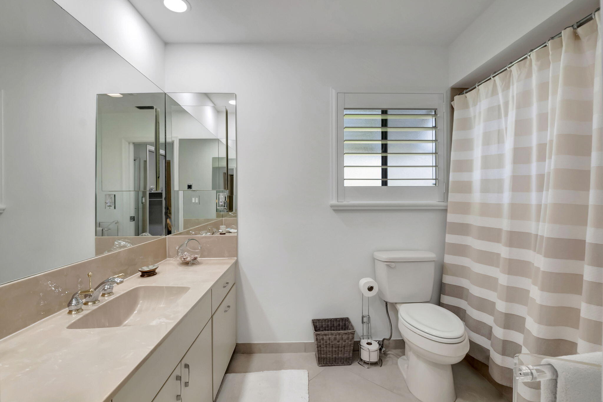 902 Foxpointe Circle Delray Beach, FL 33445 - Photo 34 of 43 a bathroom with a double vanity sink toilet and shower