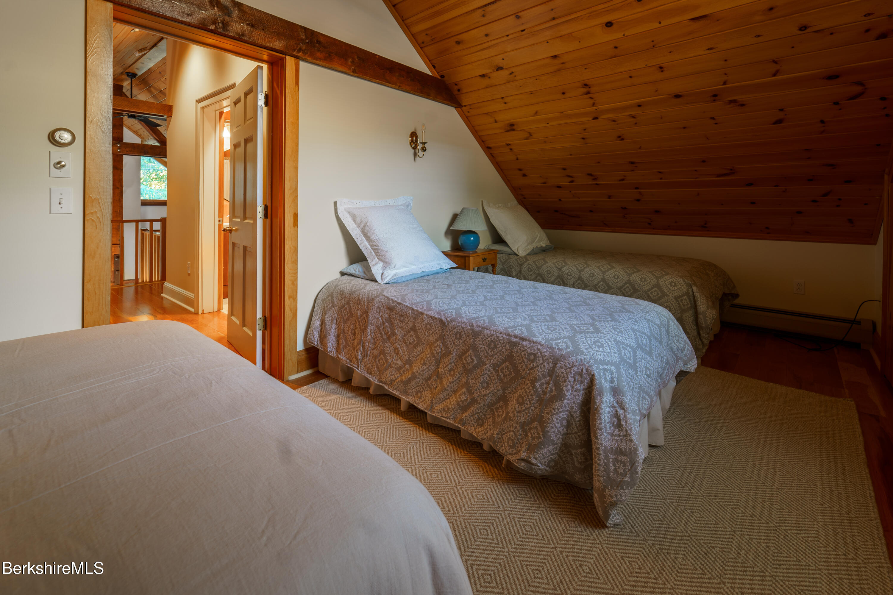 45 Taconic Avenue Lenox, MA 01240 - Photo 18 of 26 a bed sitting in a bedroom next to a window