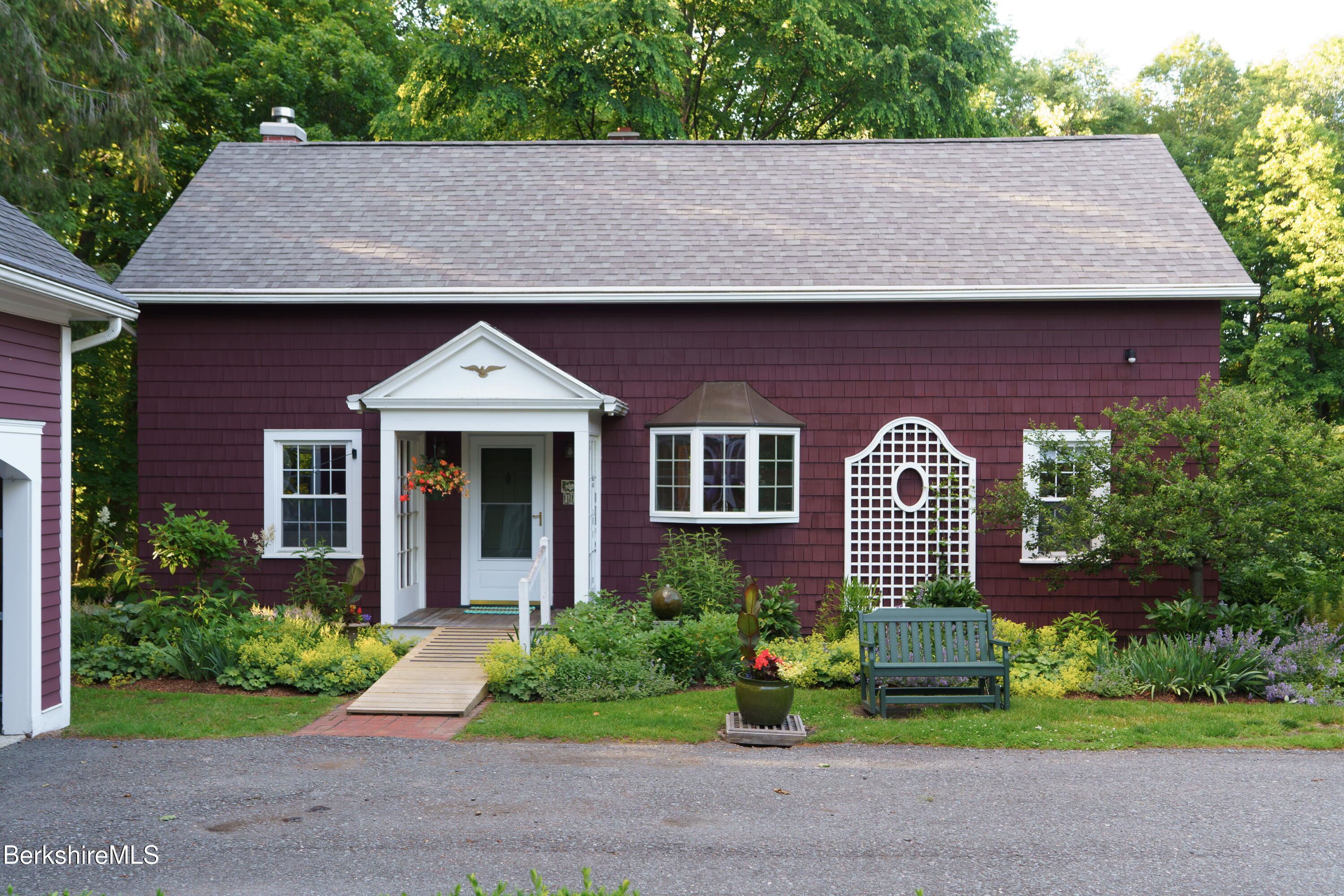 45 Taconic Avenue Lenox, MA 01240 - Photo 2 of 26 a front view of a house with a garden