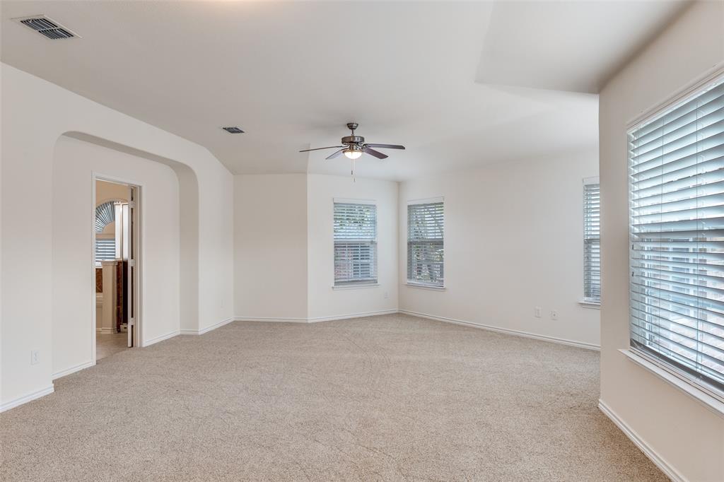 2025 Testament Trail Plano, TX 75074 - Photo 19 of 29 a view of a livingroom with a ceiling fan and window