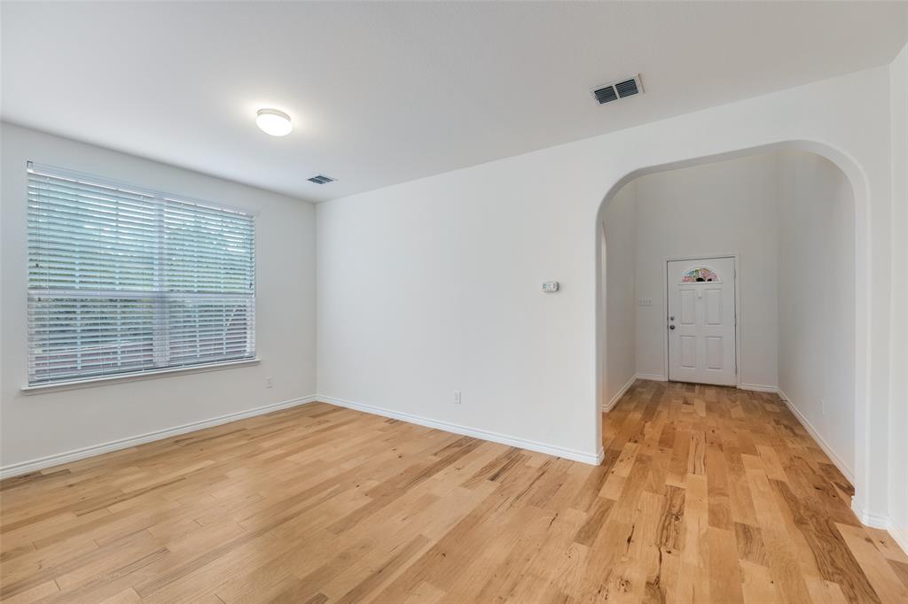 2025 Testament Trail Plano, TX 75074 - Photo 2 of 29 a view of empty room with wooden floor and fan