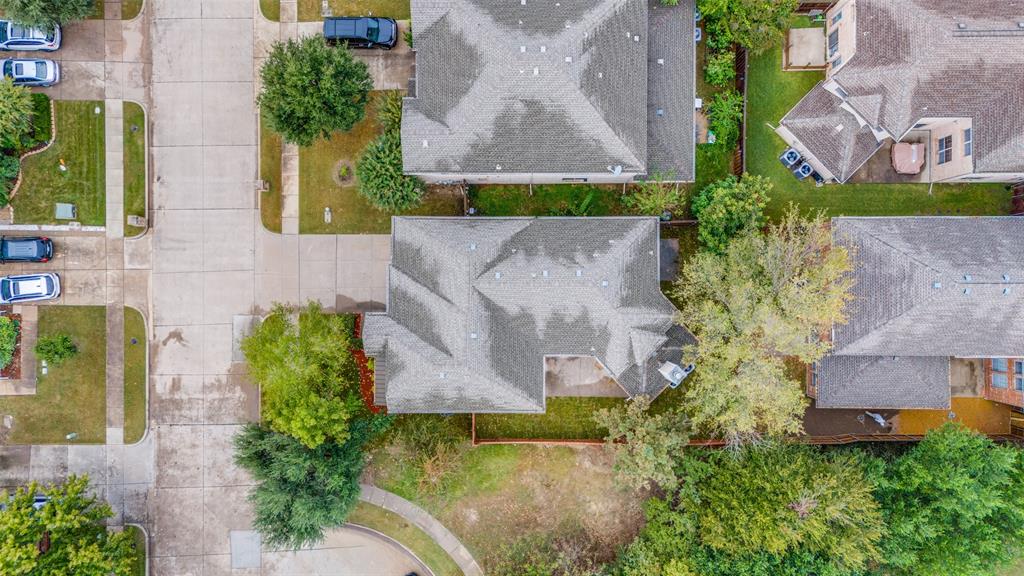 2025 Testament Trail Plano, TX 75074 - Photo 26 of 29 an aerial view of a house with a garden and a yard