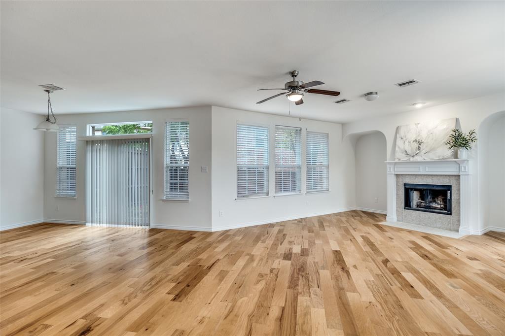 2025 Testament Trail Plano, TX 75074 - Photo 4 of 29 a view of an empty room with a fireplace and a window