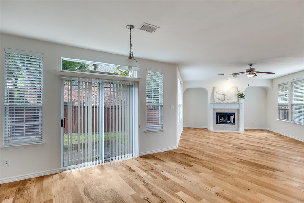 2025 Testament Trail Plano, TX 75074 - Photo 5 of 29 a view of an empty room with a window and fireplace