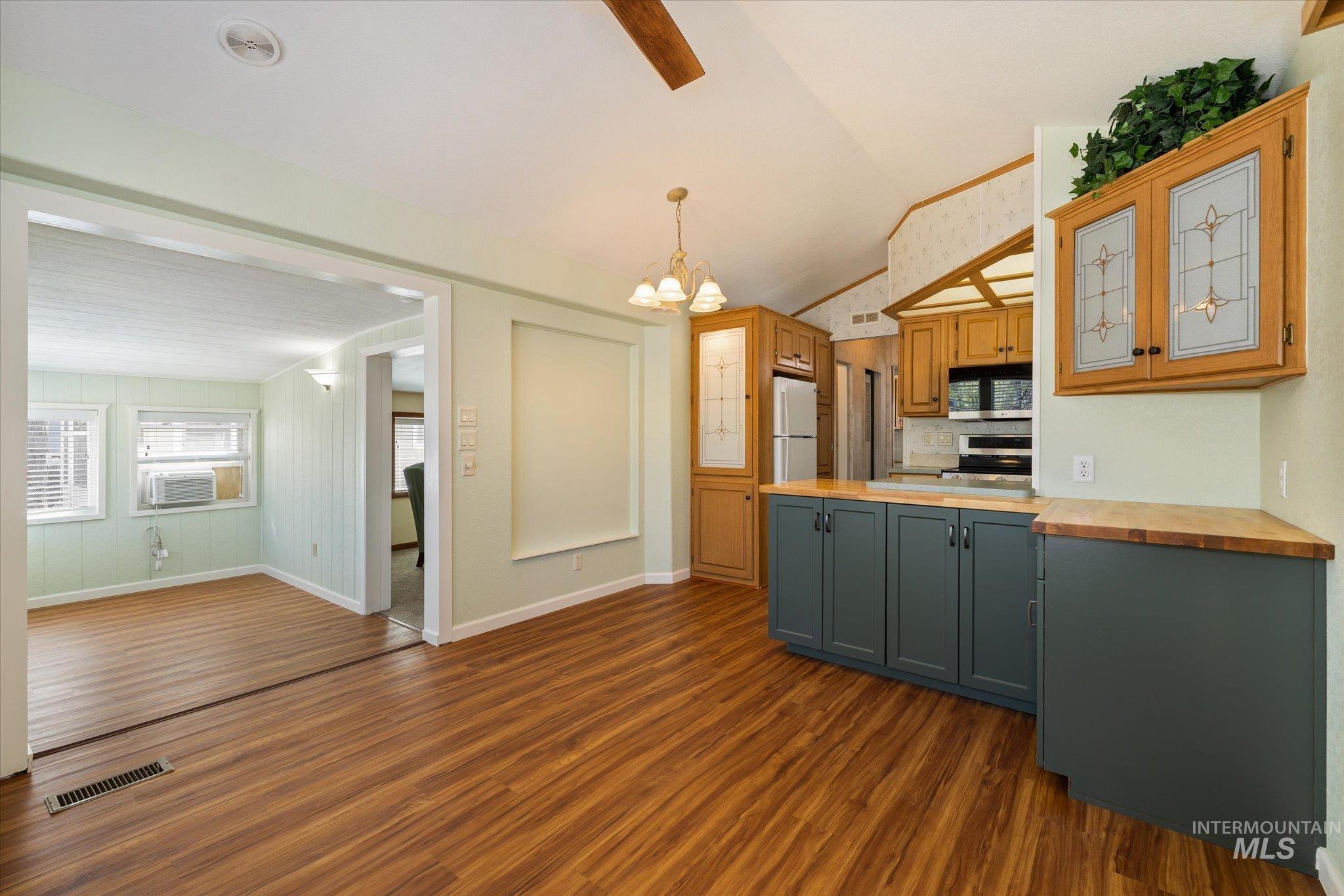 33-35 A Street Cascade, ID 83611 - Photo 6 of 20 Open-concept kitchen and dining area featuring new LVP flooring, recessed lighting, and new lower cabinetry with butcherblock countertops