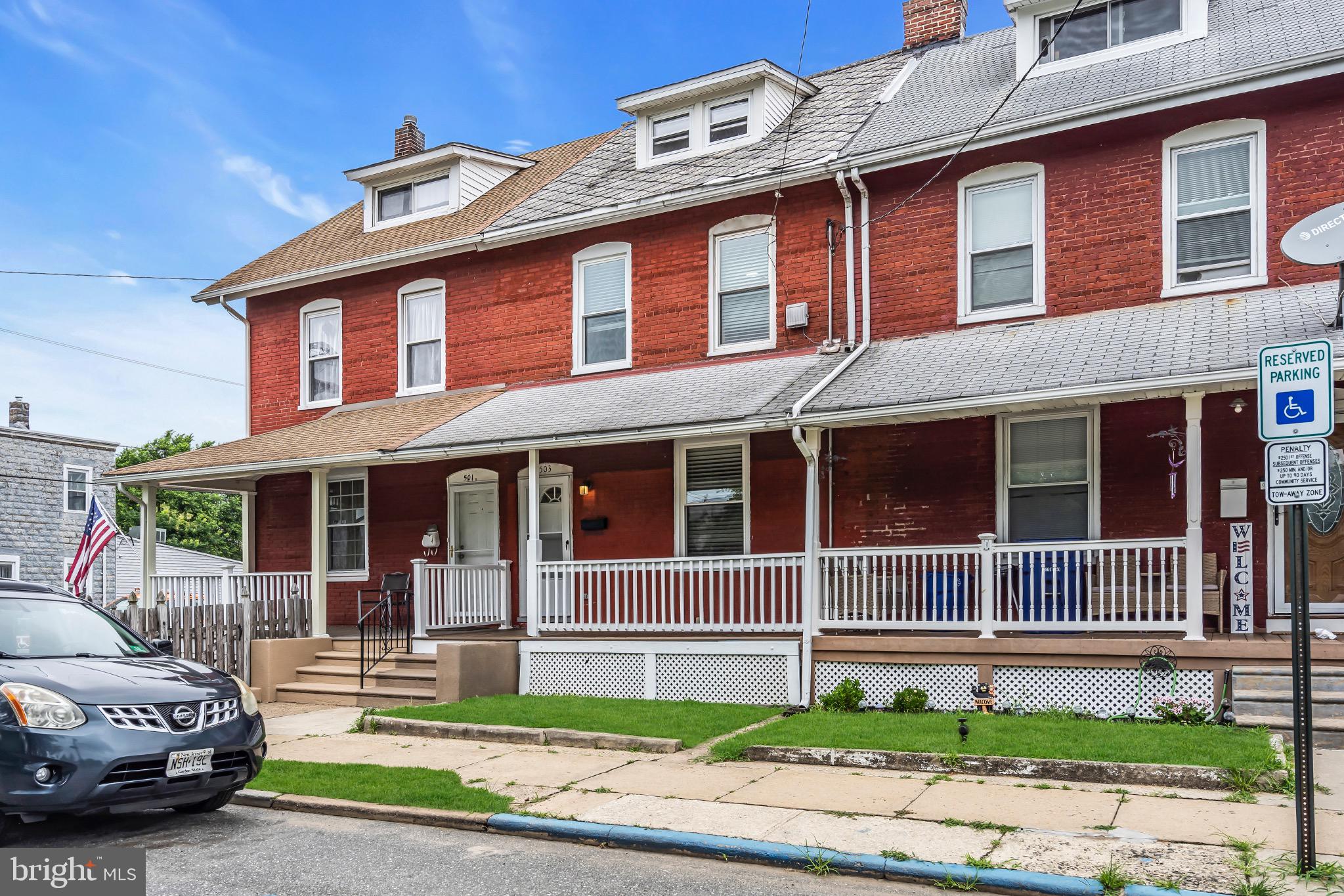 503 Kossuth Street Riverside, NJ 08075 - Photo 2 of 18 a front view of a house with a garden and plants