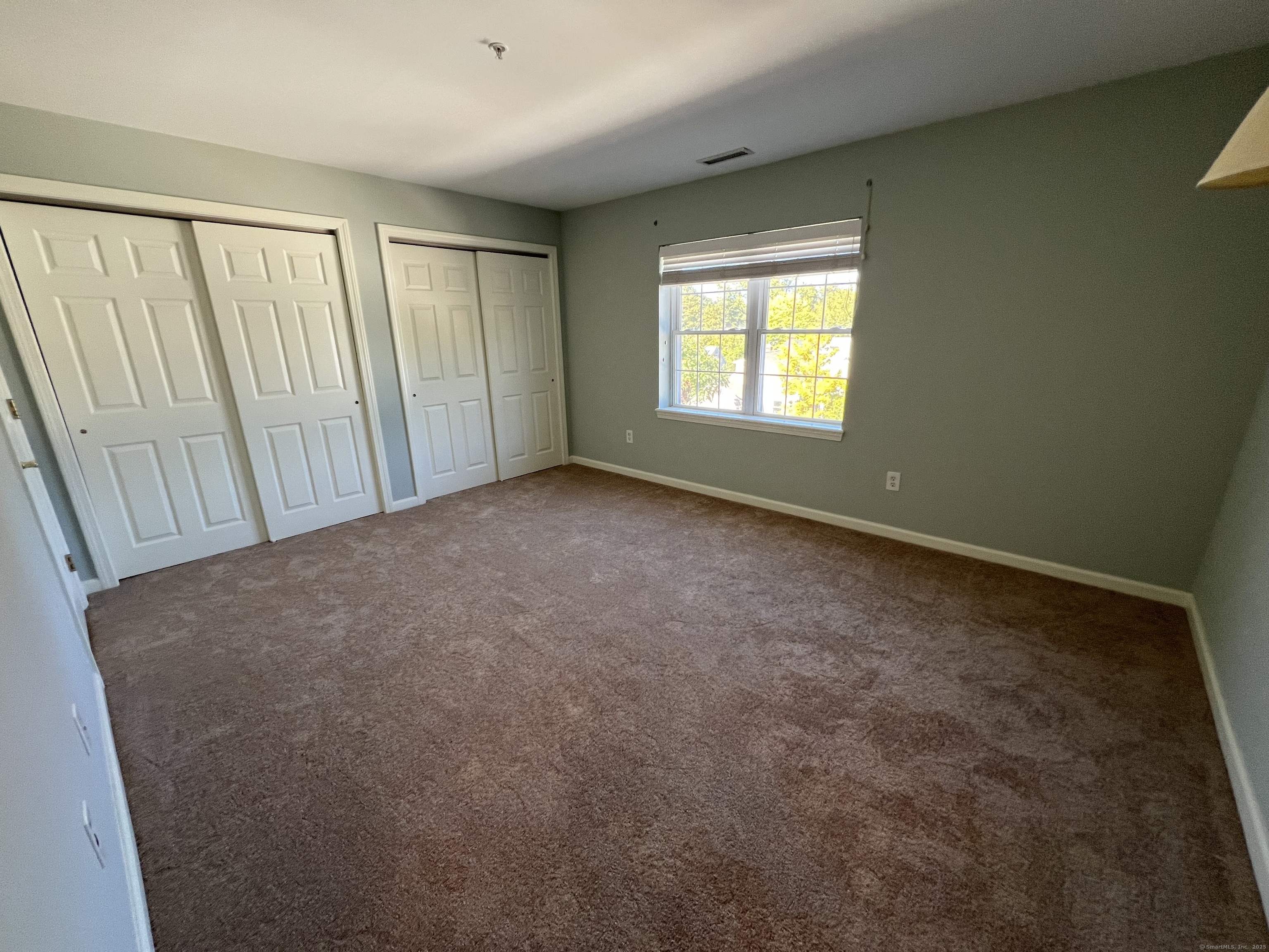 75 Washington Avenue, Unit 8403 Hamden, CT 06518 - Photo 7 of 18 an empty room with windows