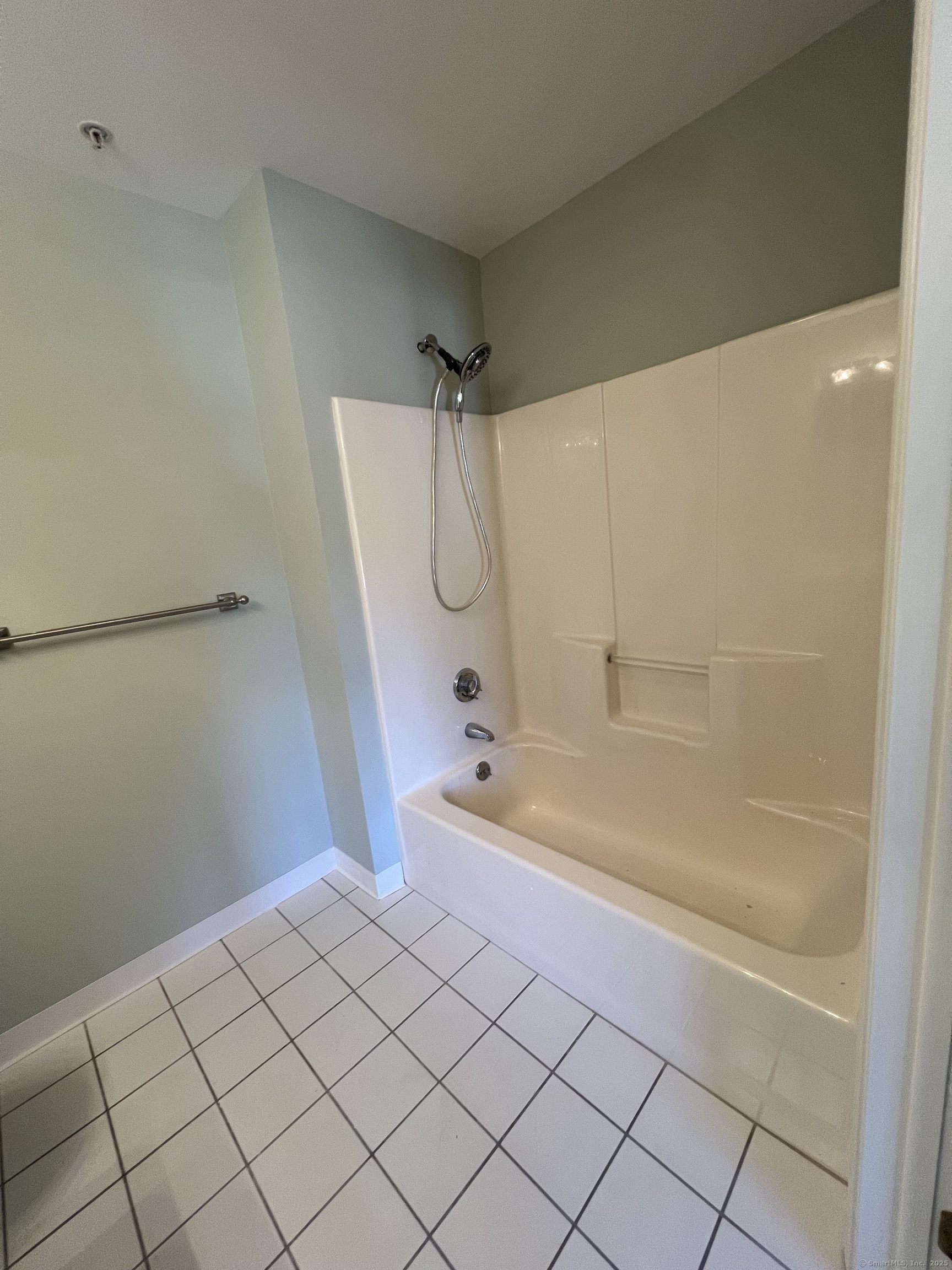 75 Washington Avenue, Unit 8403 Hamden, CT 06518 - Photo 10 of 18 a bathroom with a bathtub and a shower