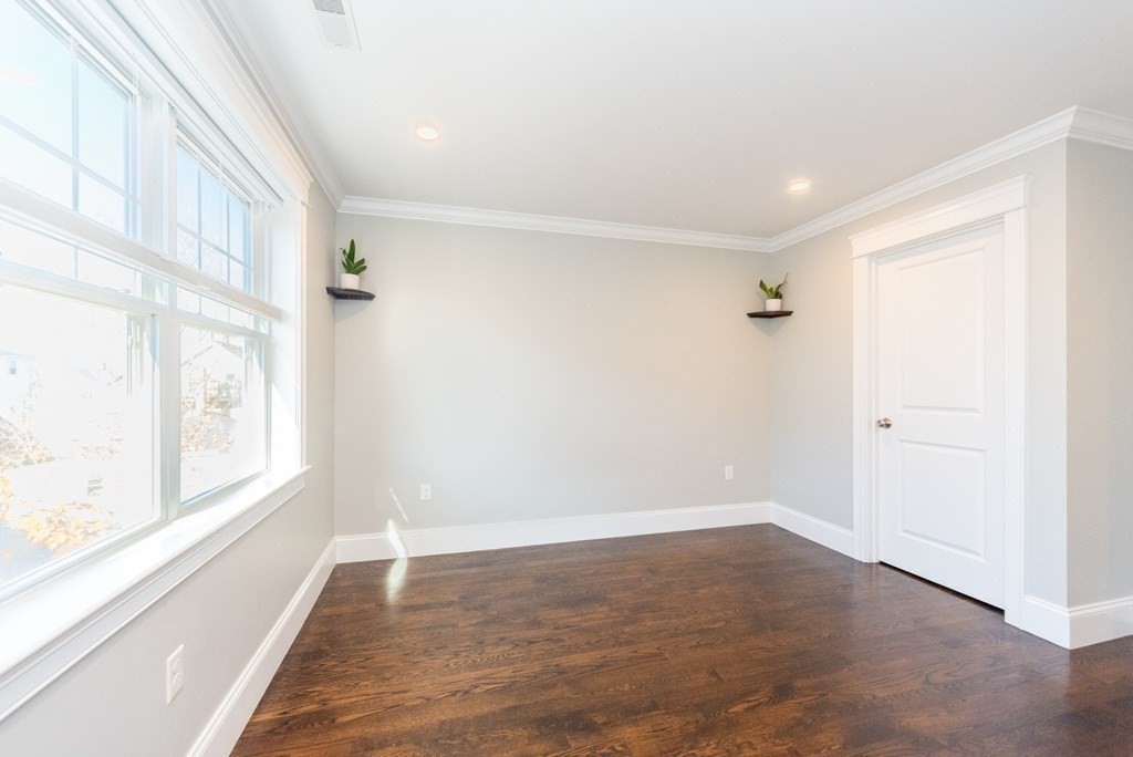 156 Ash Street, Unit 2 Waltham, MA 02453 - Photo 20 of 39 a view of an empty room with a window