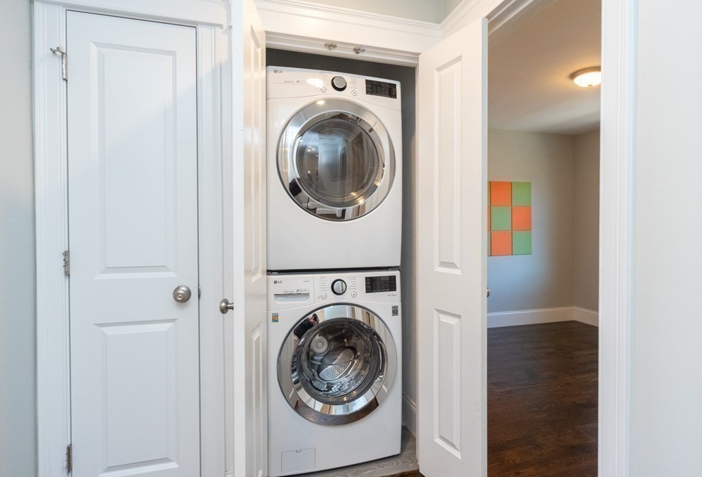 156 Ash Street, Unit 2 Waltham, MA 02453 - Photo 33 of 39 a utility room with dryer and washer