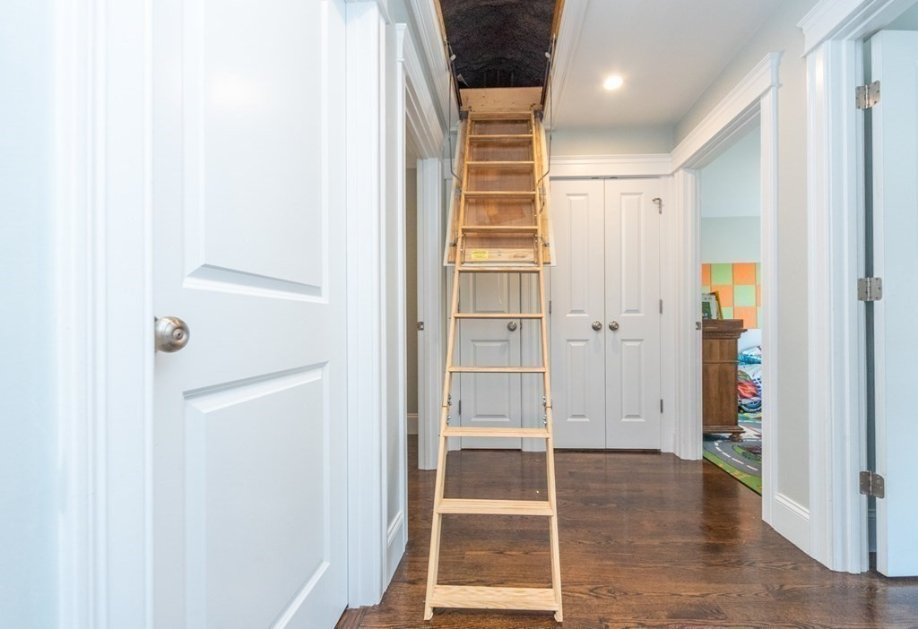 156 Ash Street, Unit 2 Waltham, MA 02453 - Photo 34 of 39 a view of front door with wooden floor