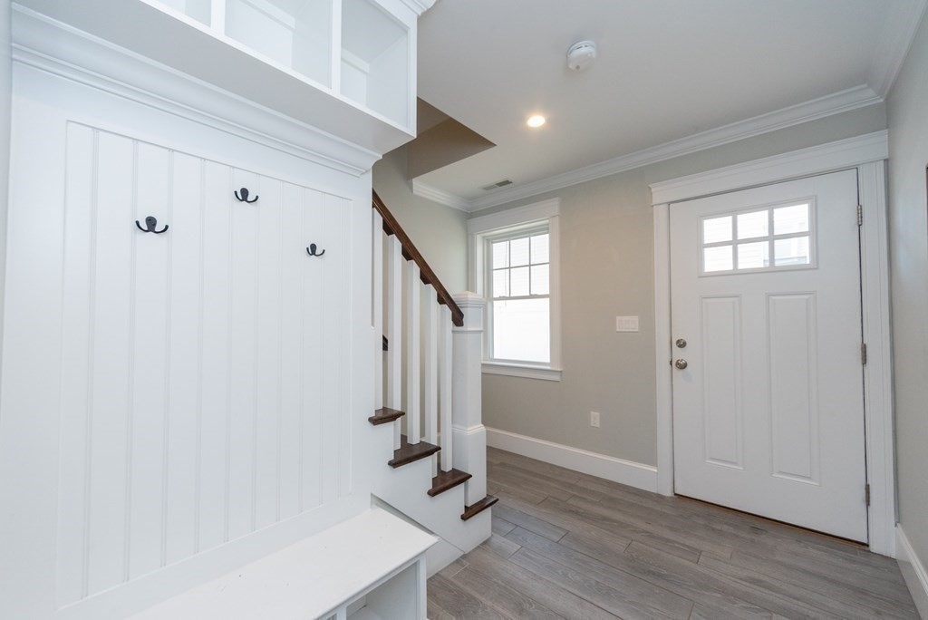 156 Ash Street, Unit 2 Waltham, MA 02453 - Photo 35 of 39 a view of entryway with wooden floor
