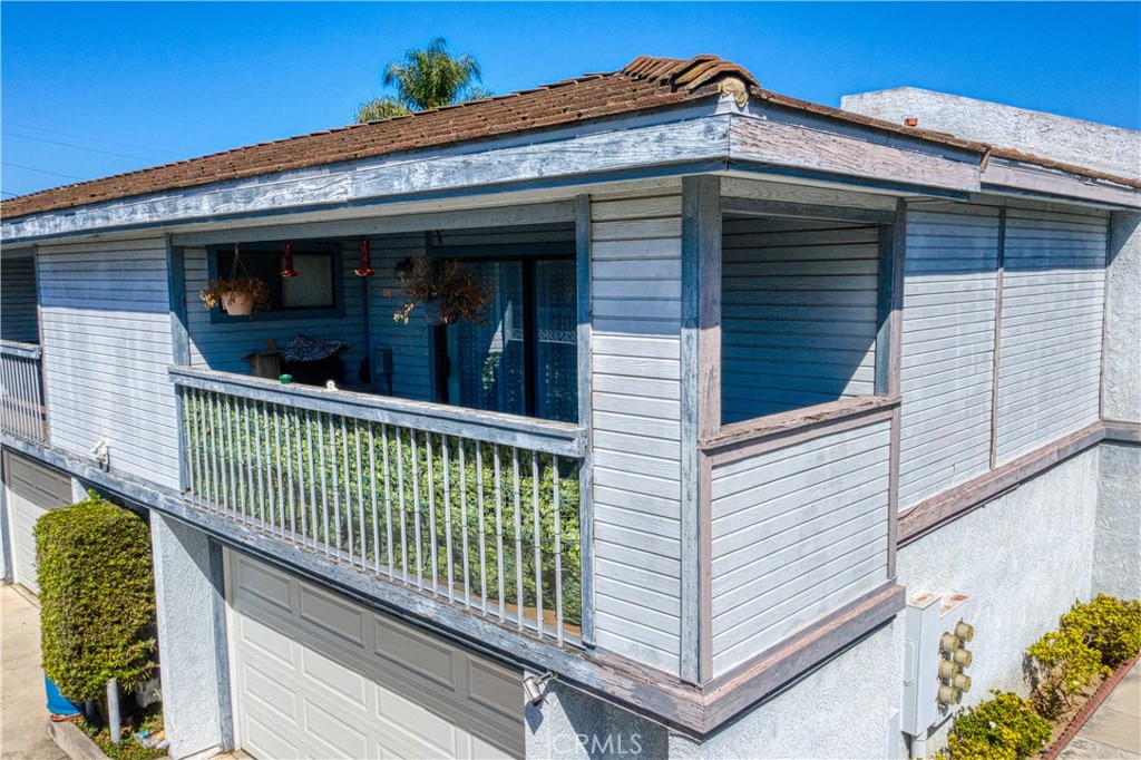 8784 Hewitt Place, Unit 12 Garden Grove, CA 92844 - Photo 13 of 54 a view of a house with a wooden fence
