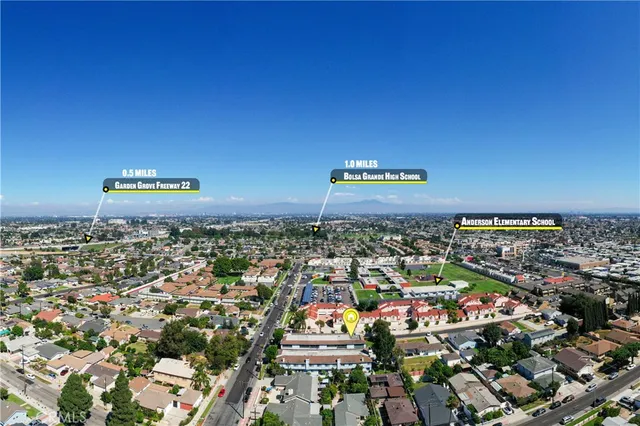 a living room with furniture a fireplace and a window