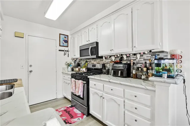 a view of living room with a flat screen tv and a window