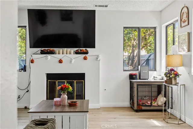 a bedroom with a bed and a view of kitchen