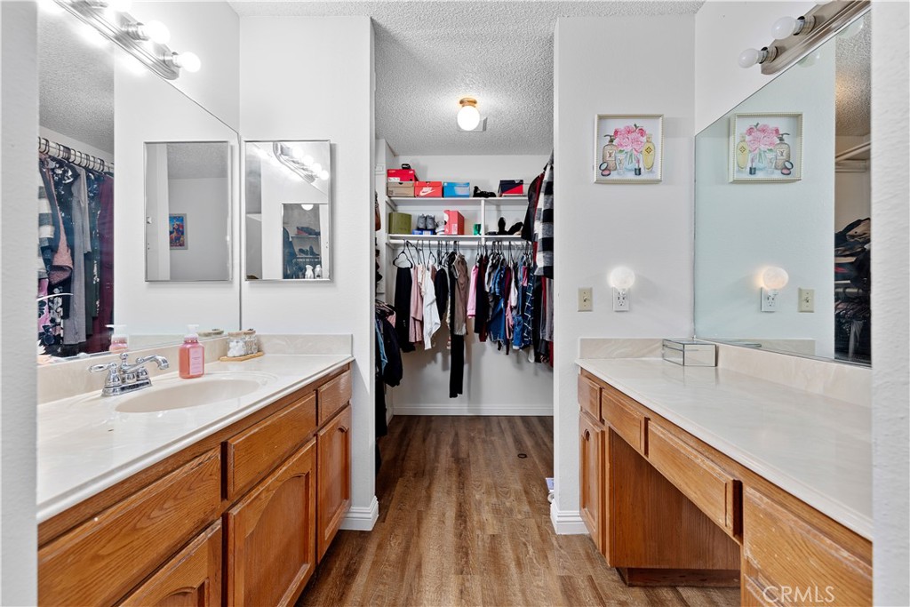 8784 Hewitt Place, Unit 12 Garden Grove, CA 92844 - Photo 42 of 54 a view of a kitchen area with furniture and wooden floor