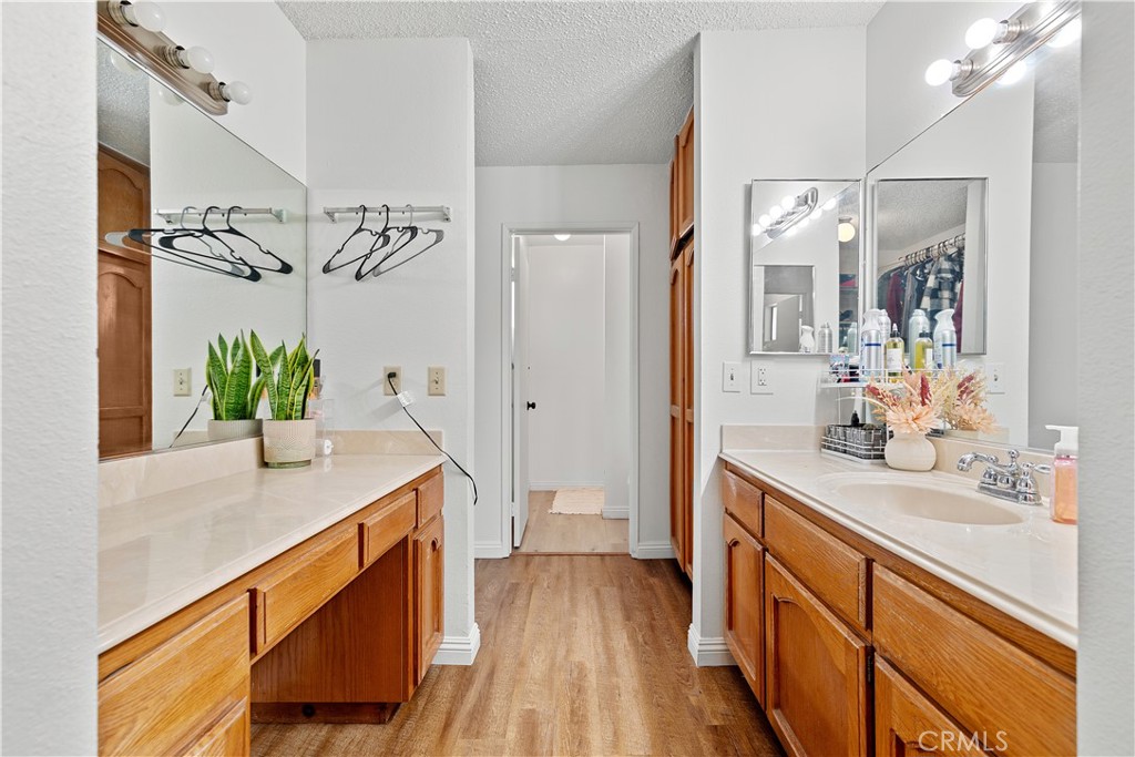 8784 Hewitt Place, Unit 12 Garden Grove, CA 92844 - Photo 43 of 54 a spacious bathroom with a granite countertop sink a mirror and a shower