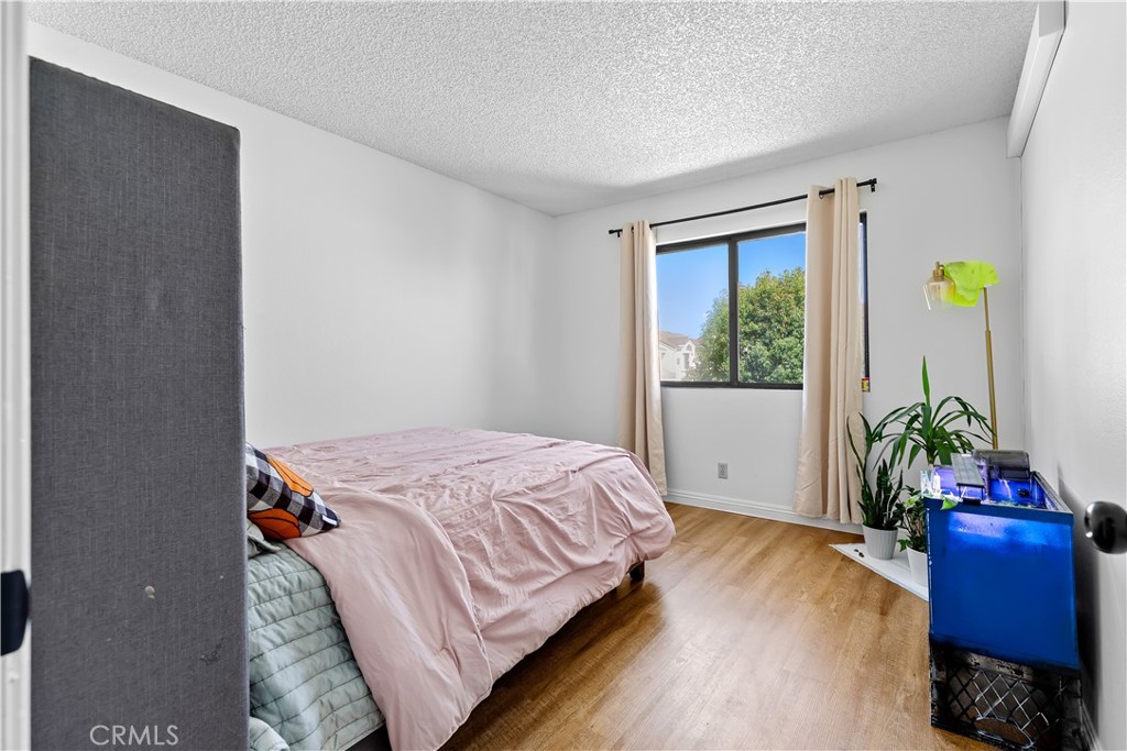 8784 Hewitt Place, Unit 12 Garden Grove, CA 92844 - Photo 45 of 54 a bed sitting in a bedroom next to a window