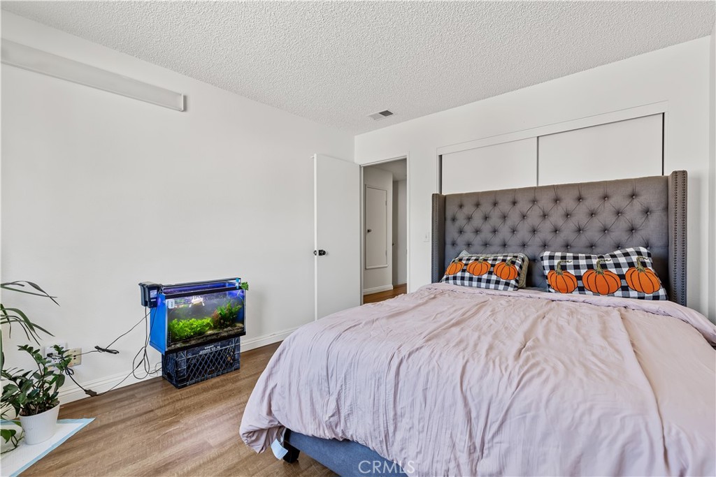 8784 Hewitt Place, Unit 12 Garden Grove, CA 92844 - Photo 46 of 54 a bed room with a bed and a television