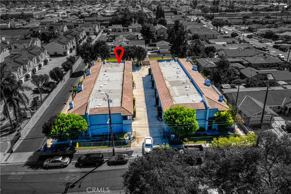 8784 Hewitt Place, Unit 12 Garden Grove, CA 92844 - Photo 8 of 54 an aerial view of a house with a yard and potted plants