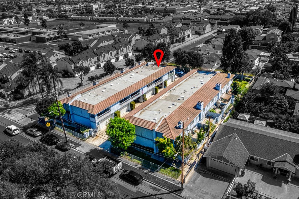 8784 Hewitt Place, Unit 12 Garden Grove, CA 92844 - Photo 9 of 54 an aerial view of a house with a garden and plants