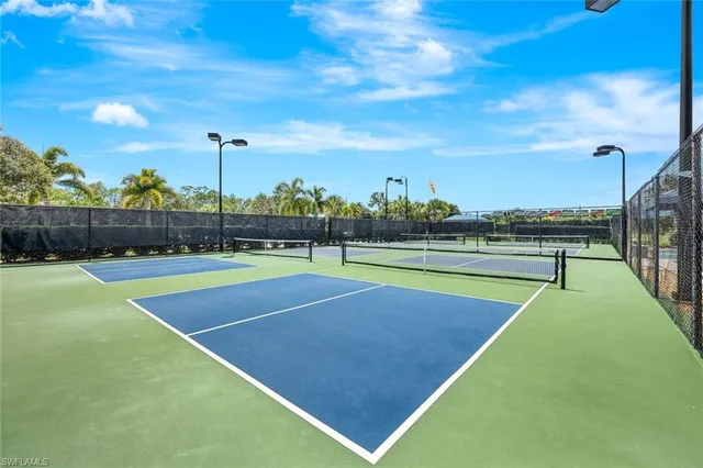 a view of a swimming pool with a yard