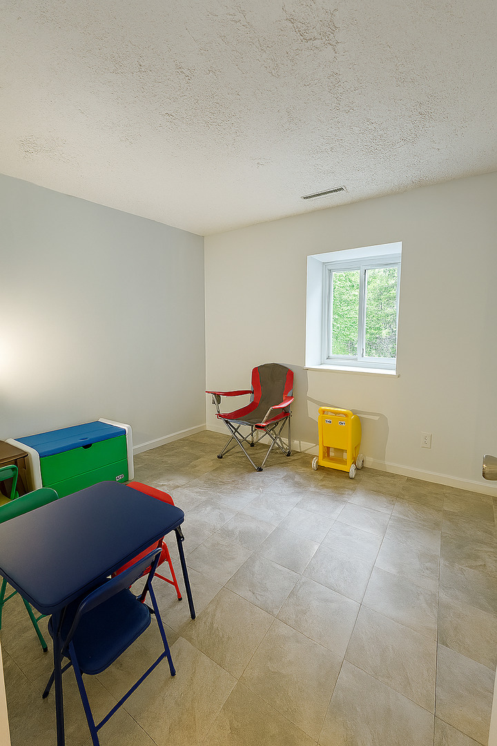1119 South Curtis Avenue, Unit F64 Kankakee, IL 60901 - Photo 10 of 13 a living room with furniture and a window