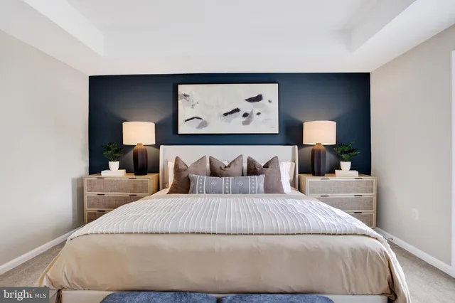 a bedroom with a bed and a night stand