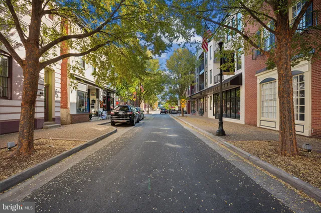a view of street with parked cars