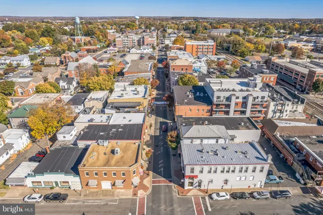 an aerial view of residential houses with city view