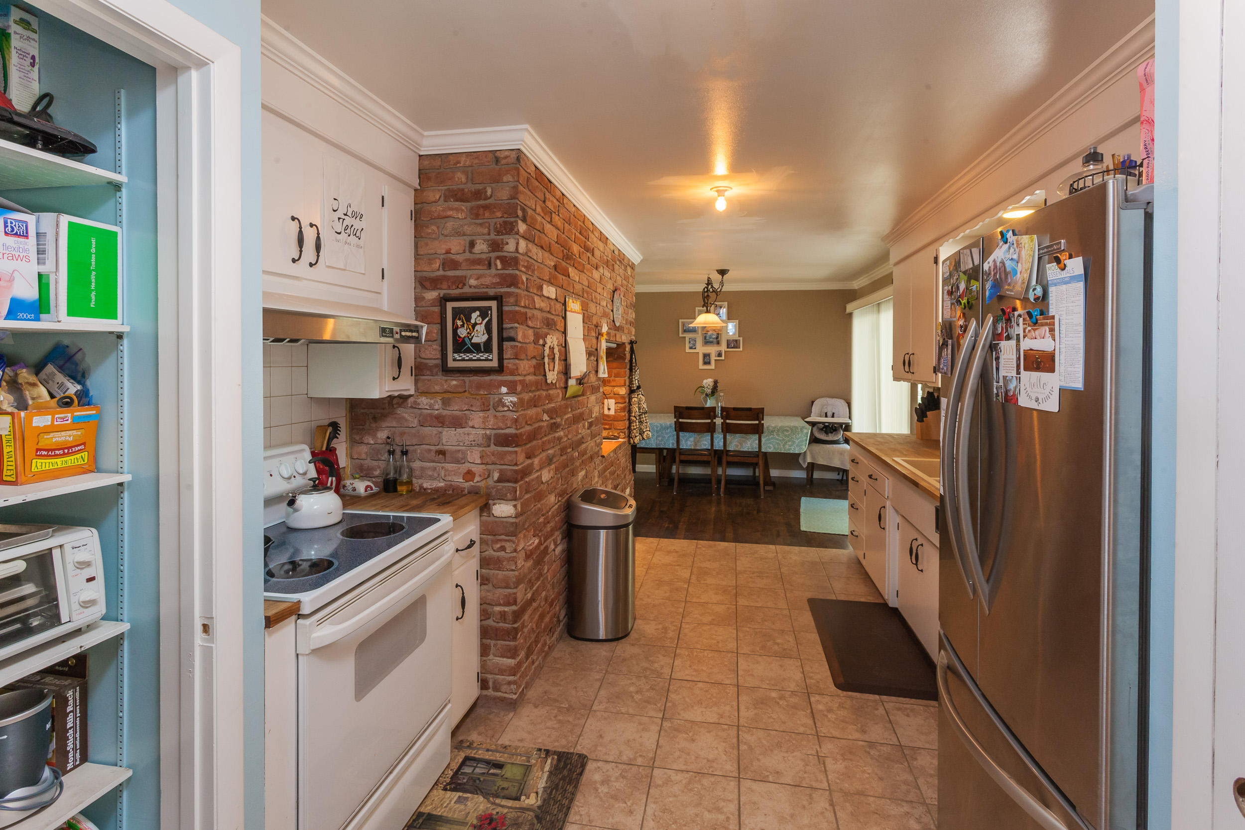 8680 Valley View Road Redding, CA 96001 - Photo 11 of 33 a kitchen with stainless steel appliances granite countertop a refrigerator and a stove