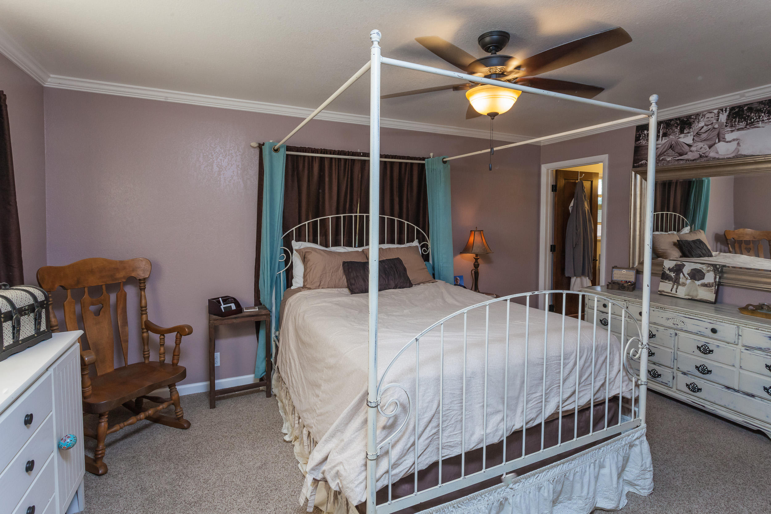 8680 Valley View Road Redding, CA 96001 - Photo 16 of 33 a bedroom with bed and wooden floor