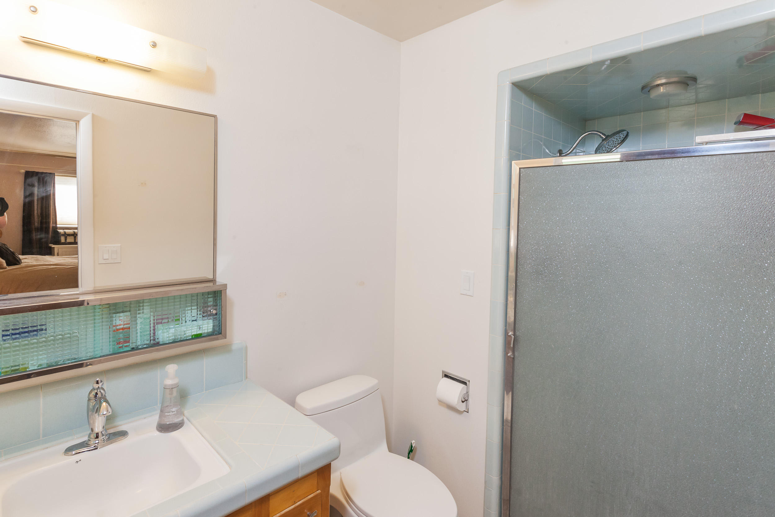 8680 Valley View Road Redding, CA 96001 - Photo 18 of 33 a bathroom with a sink a toilet and mirror