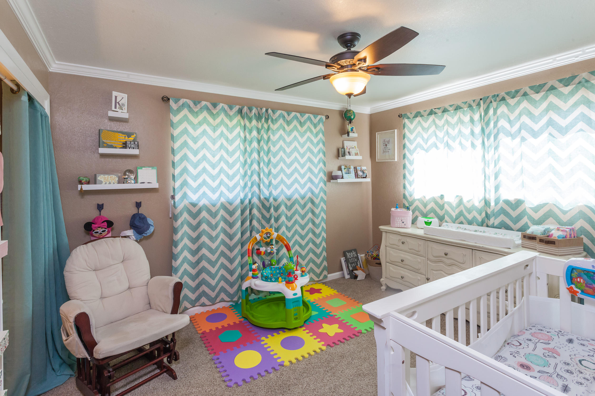 8680 Valley View Road Redding, CA 96001 - Photo 19 of 33 a bedroom with furniture a baby crib and a wooden floor