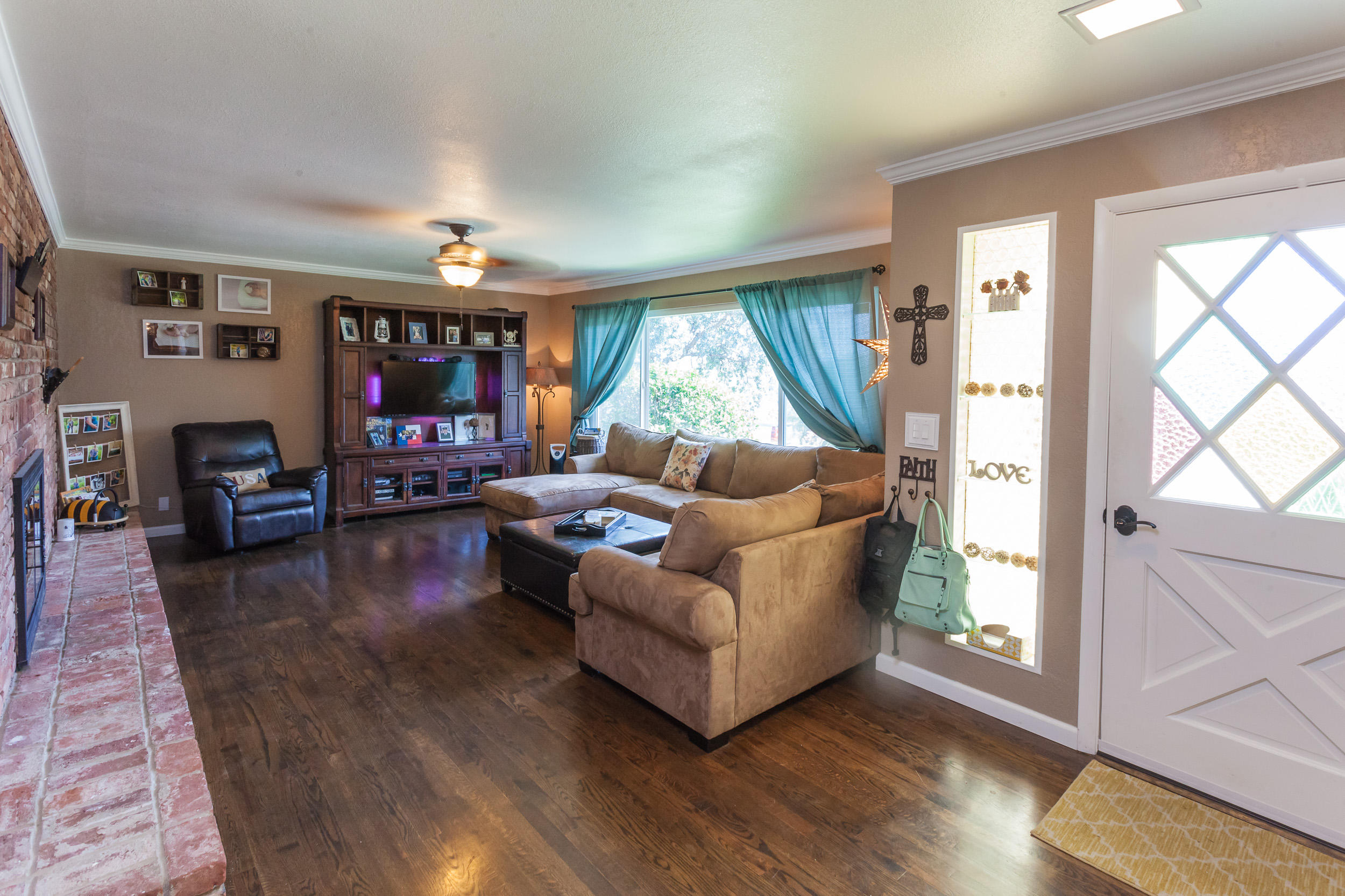 8680 Valley View Road Redding, CA 96001 - Photo 2 of 33 a living room with furniture and a flat screen tv