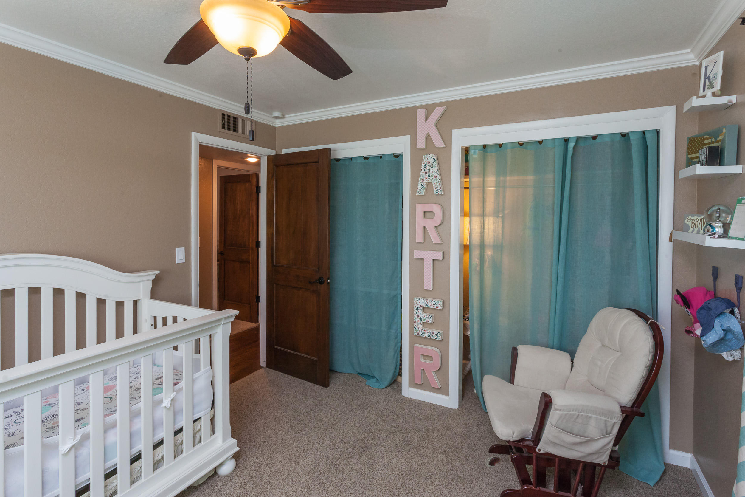 8680 Valley View Road Redding, CA 96001 - Photo 21 of 33 a view of a hallway with furniture and a livingroom