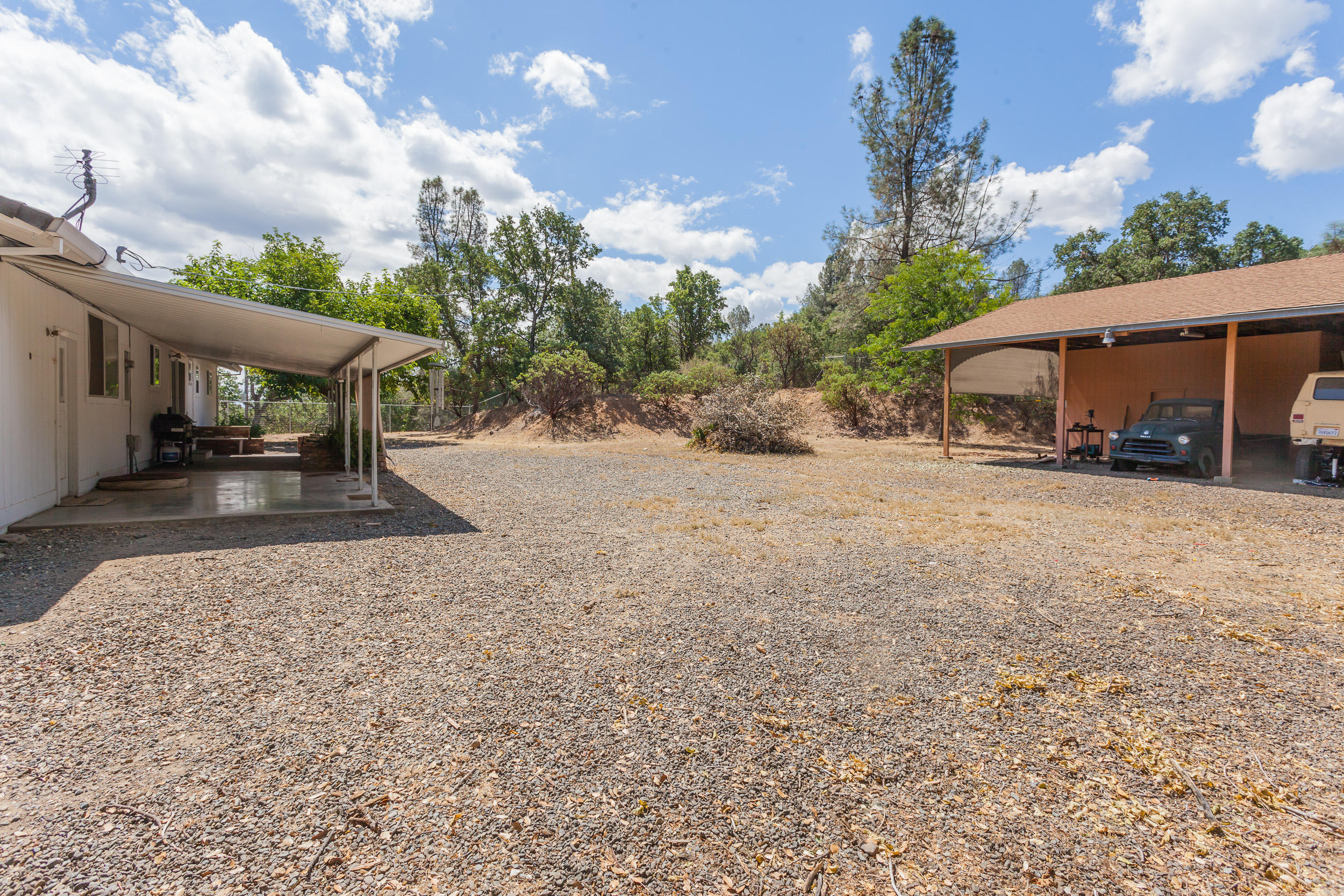 8680 Valley View Road Redding, CA 96001 - Photo 24 of 33 a view of a house with a yard