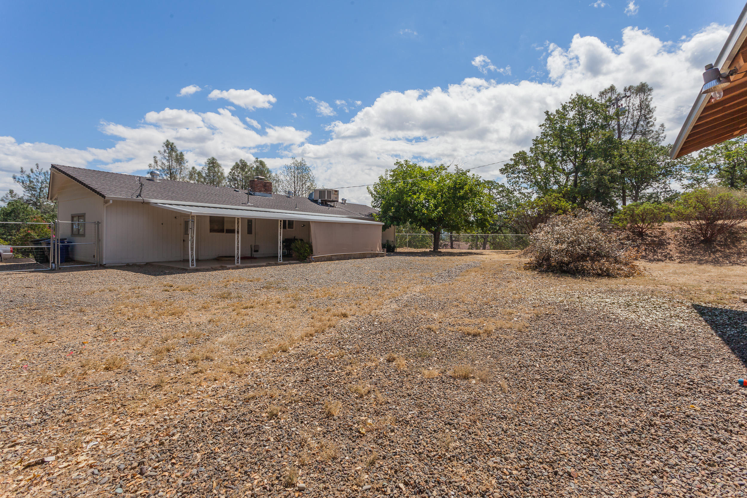 8680 Valley View Road Redding, CA 96001 - Photo 25 of 33 a view of a house with a yard