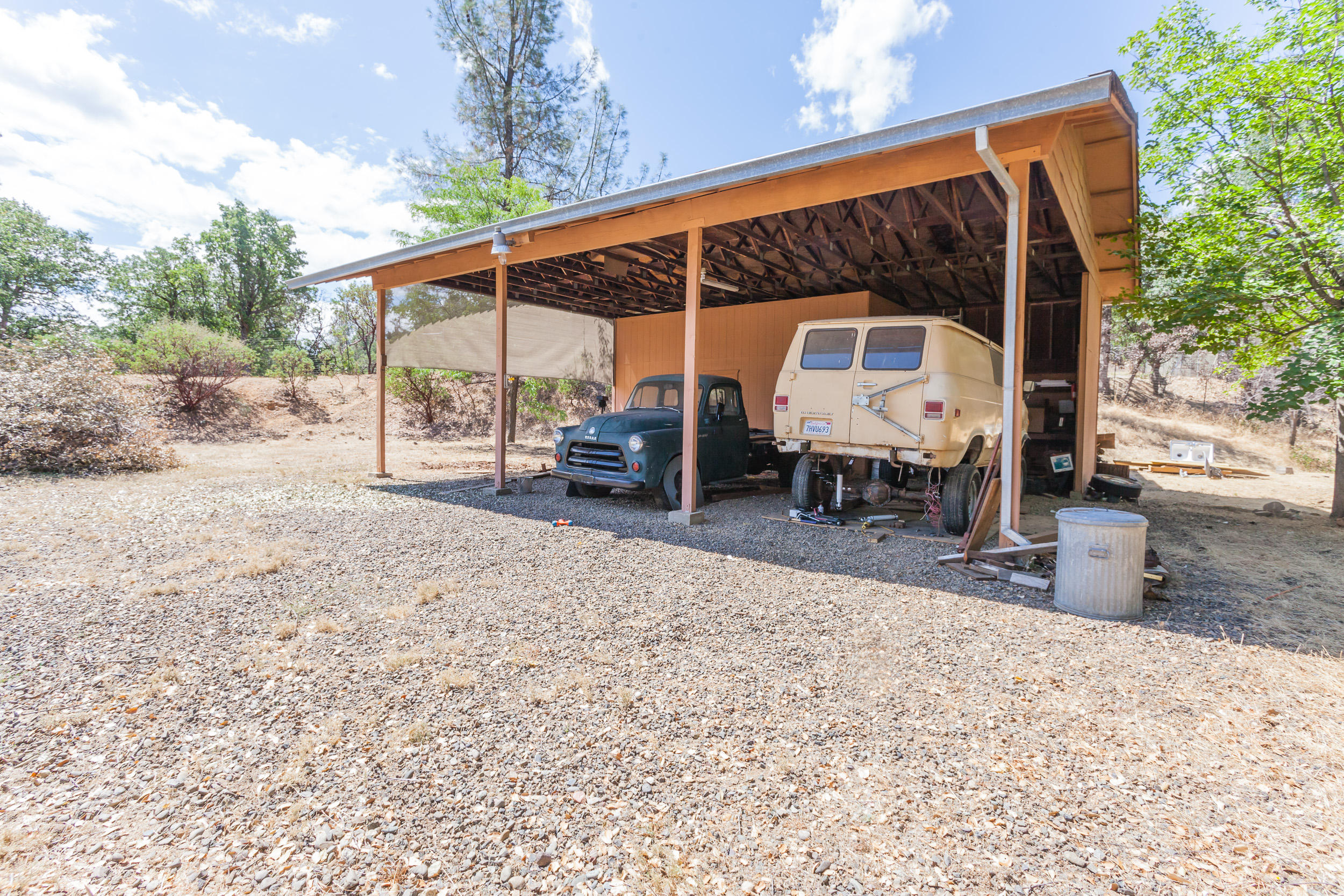 8680 Valley View Road Redding, CA 96001 - Photo 26 of 33 a view of a patio with a table and chairs under an umbrella