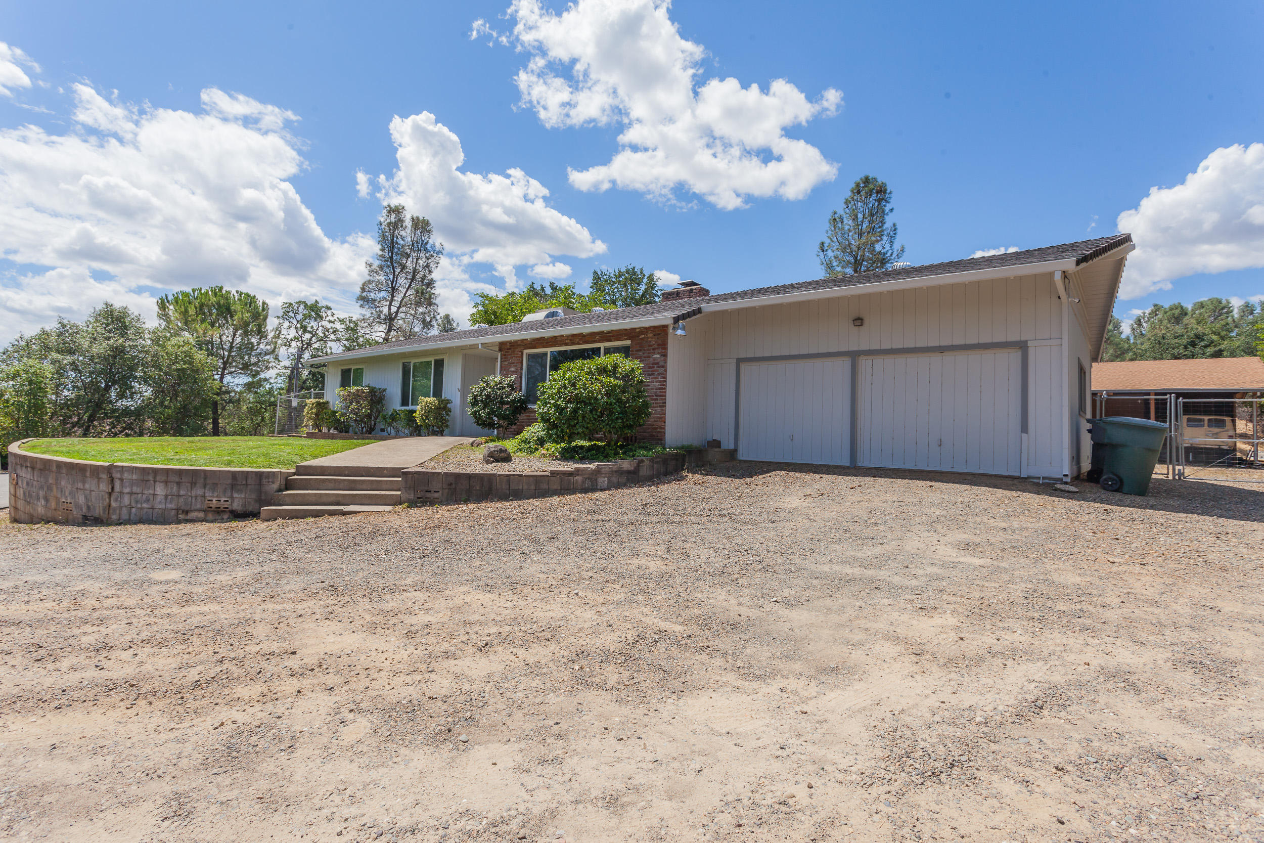 8680 Valley View Road Redding, CA 96001 - Photo 30 of 33 a front view of a house with garden