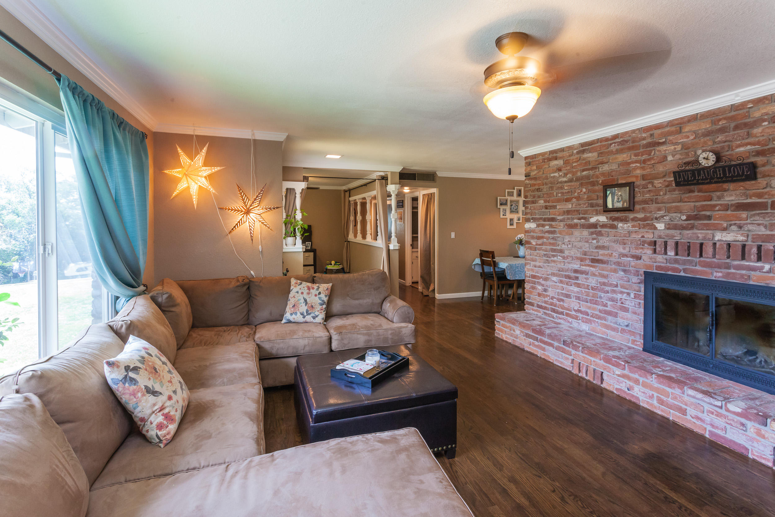8680 Valley View Road Redding, CA 96001 - Photo 4 of 33 a living room with furniture and a fireplace