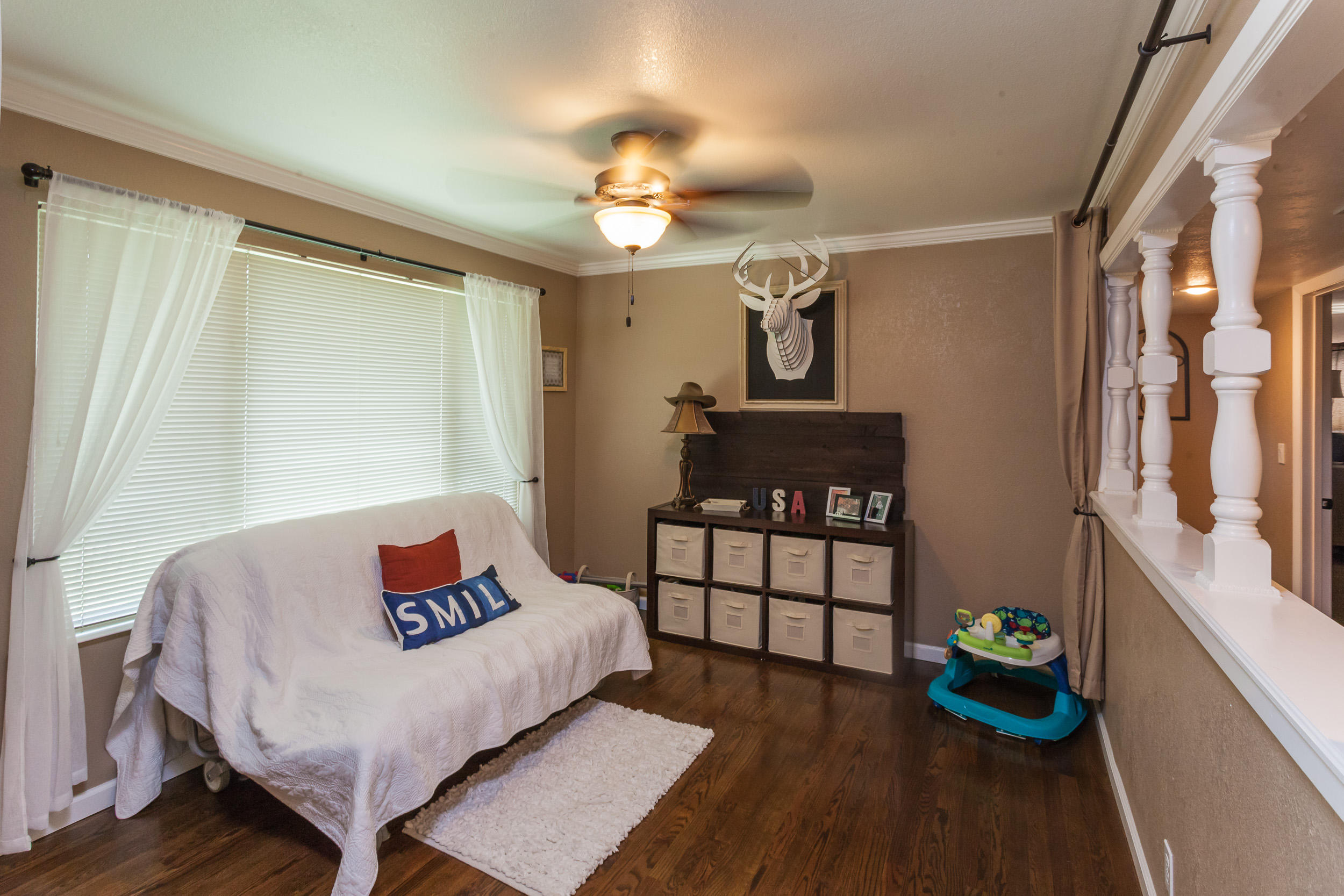 8680 Valley View Road Redding, CA 96001 - Photo 5 of 33 a living room with furniture and a chandelier