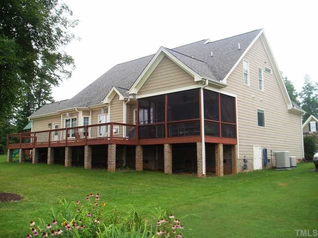 472 Waterville Street Raleigh, NC 27603 - Photo 2 of 7 Rear of home featuring extensive deck and screened porch