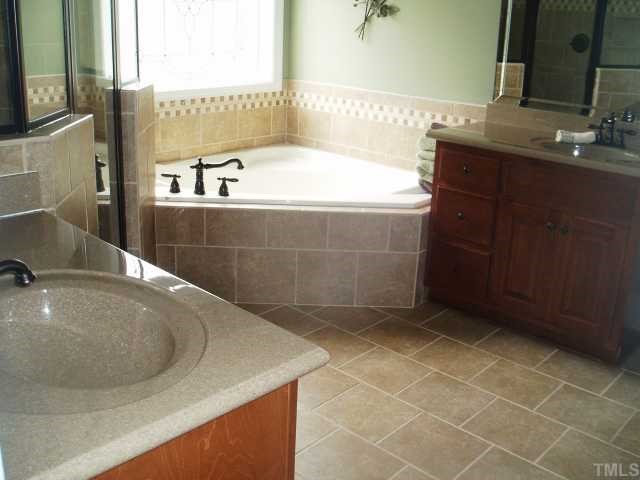 472 Waterville Street Raleigh, NC 27603 - Photo 5 of 7 Chef's delight. Granite countertops and solid wood cabinets in kitchen.....just gorgeous
