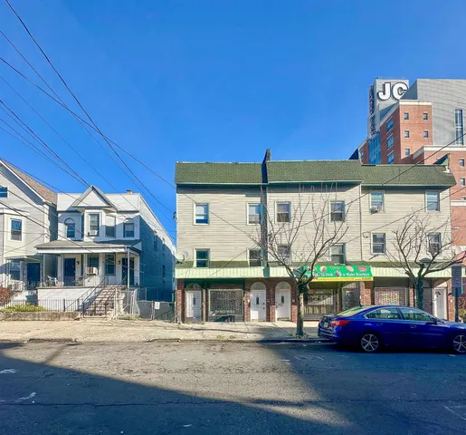 a front view of building with street