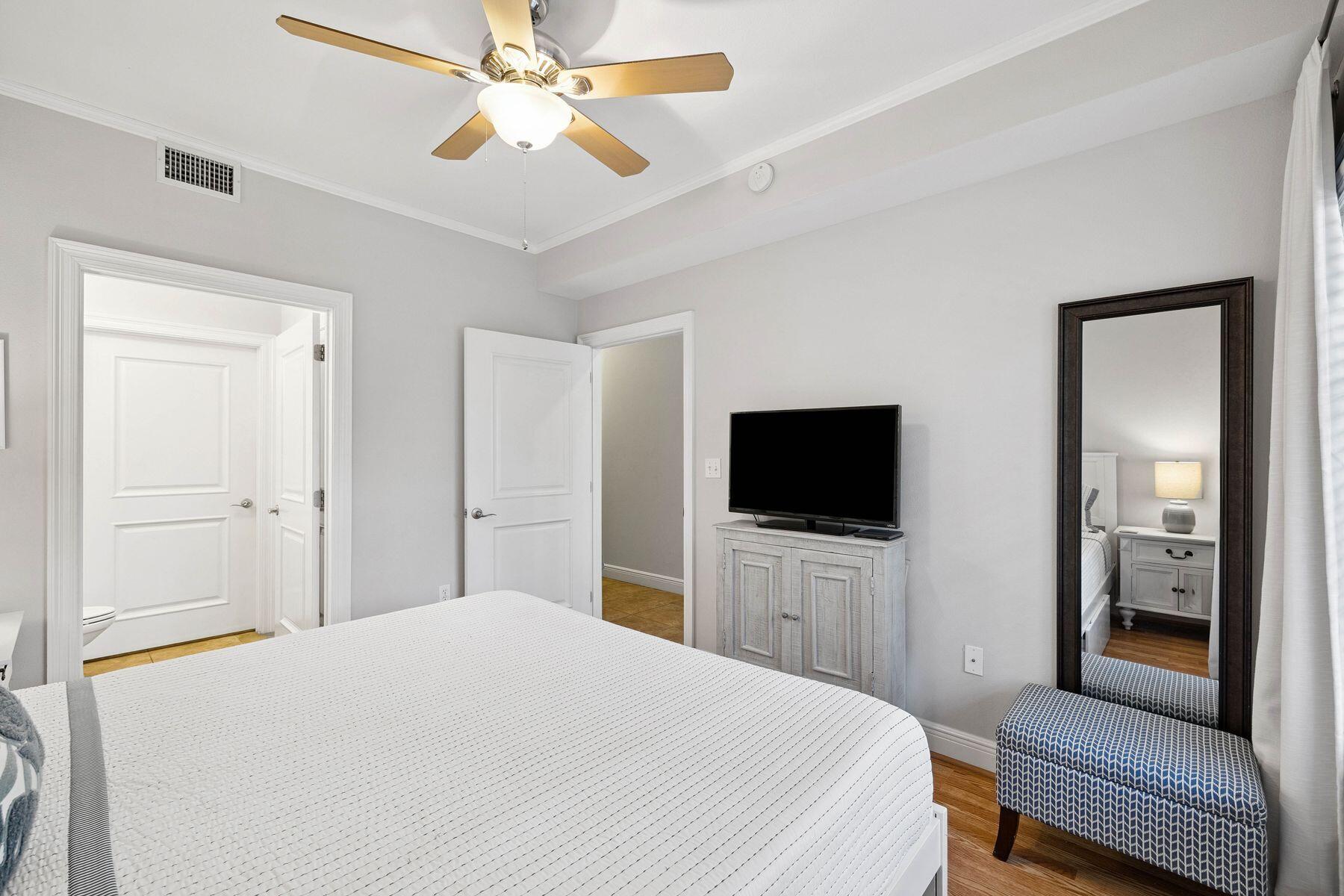 43 Cassine Way, Unit 207 Santa Rosa Beach, FL 32459 - Photo 13 of 28 a bedroom with a bed and a flat screen tv