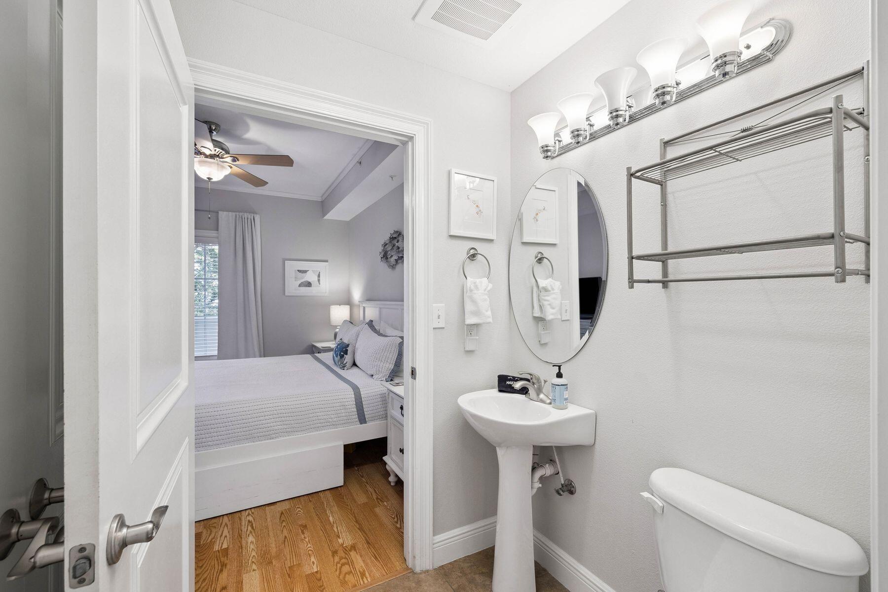 43 Cassine Way, Unit 207 Santa Rosa Beach, FL 32459 - Photo 14 of 28 a bathroom with a sink a toilet and shower