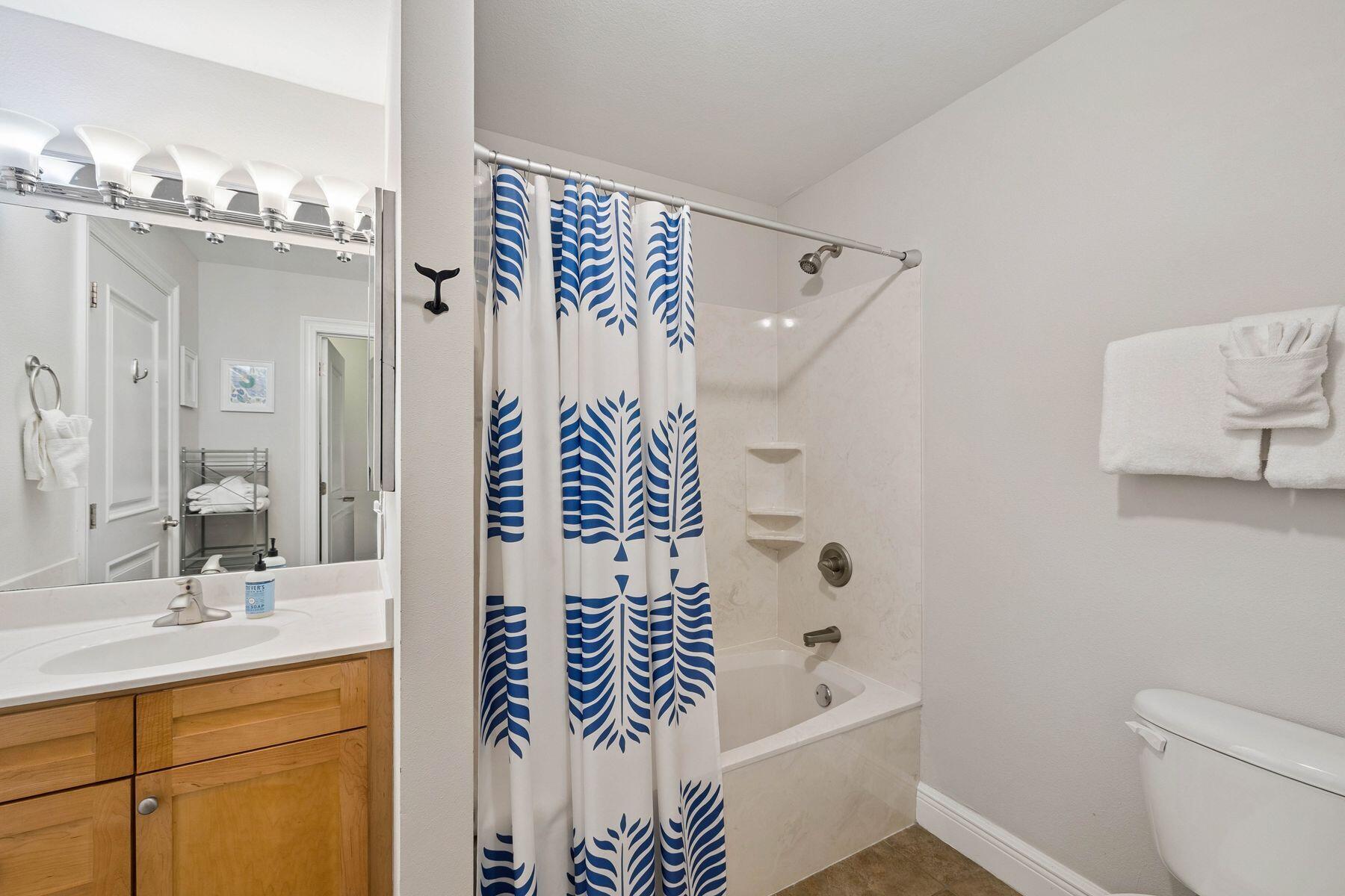 43 Cassine Way, Unit 207 Santa Rosa Beach, FL 32459 - Photo 15 of 28 a bathroom with a bathtub sink vanity and toilet
